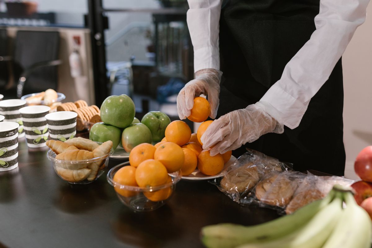Caterer arranging elegant food display